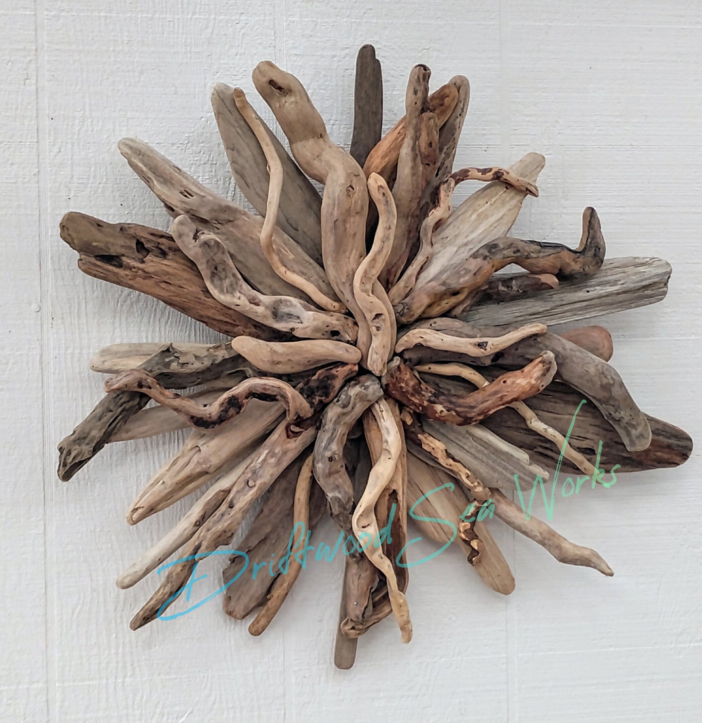 Rustic wooden sunburst wall hanging Handcrafted with natural driftwood sticks from the Oregon Coastline