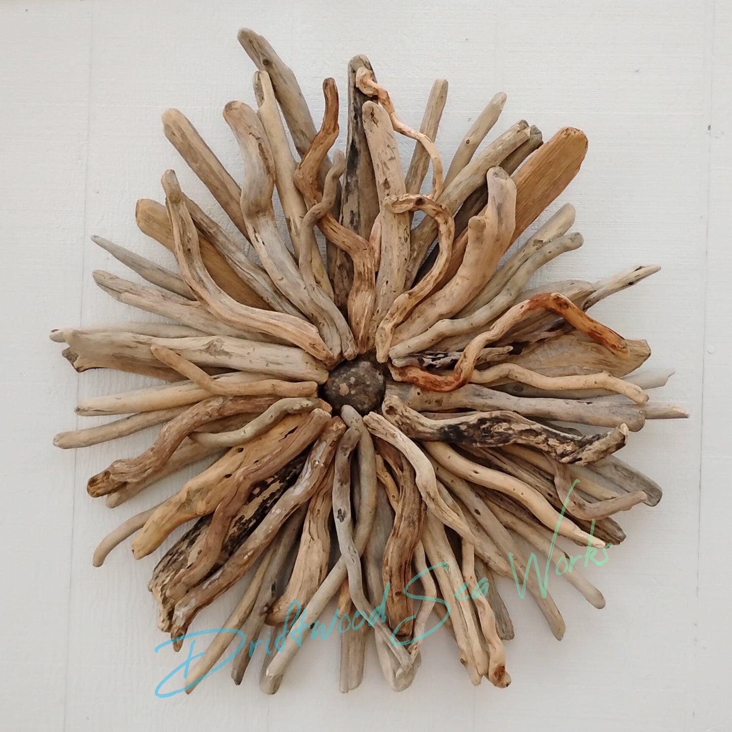 This unique and natural starburst measures 26 x 26 x 5 inches. I made it with driftwood I collected along the beaches of Oregon.
Each Driftwood sculpture is unique and hand made with hand selected driftwood pieces attached one piece at a time using nails for long lasting strength and durability not glue. I have also attached a saw tooth hook on the back for easy hanging as well