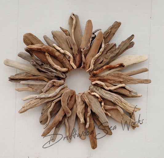 Large driftwood wall art wreath handcrafted in Oregon with natural driftwood sticks 