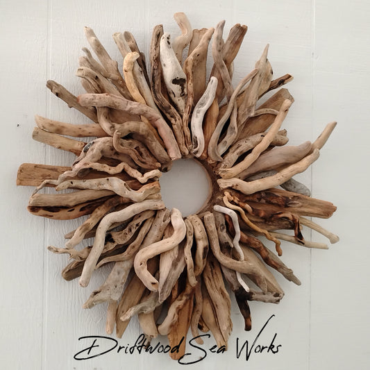 This large natural driftwood wreath statement piece measures approximately 29 x 29 inches. The inner circle measures 5 inches and the colors are various shades of brown and beige.
I have also added a saw tooth hanger on the back for easy hanging.
My wreaths are put together with brad nails not glue so they are durable and will hold up well.
Everything you see in my shop is handmade by me in Oregon.