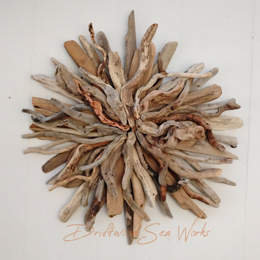 Create a stunning, one of a kind, striking focal point by hanging this in natural driftwood sunburst over the couch or above the fireplace. These are beautiful in a coastal themed bedroom as well.