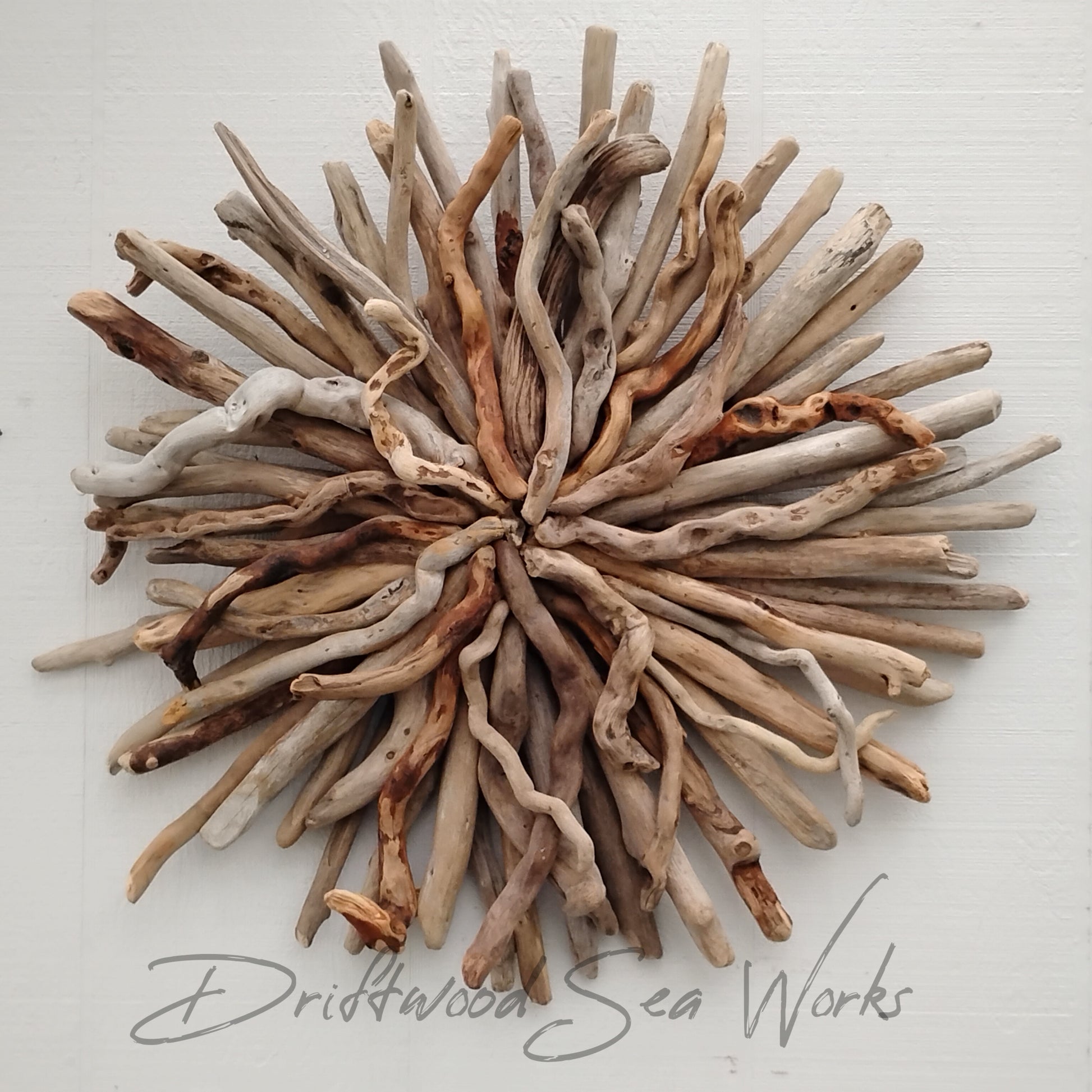 This natural driftwood art sunburst wall sculpture incorporates natural, organic beauty into any space and is handcrafted with real driftwood sticks from the the Oregon Coastline. Create a stunning, one of a kind, striking focal point by hanging it over the couch or above the fireplace. These are beautiful in a coastal themed bedroom as well.