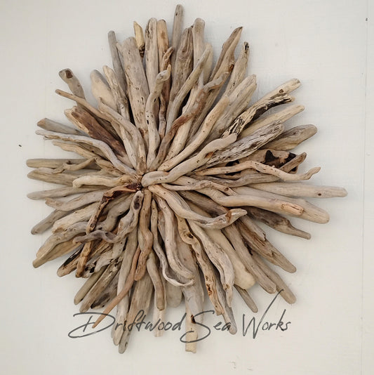 This unique and natural starburst measures 26 x 25 x 5 inches. I made it with driftwood I collected along the beaches of Oregon.
Each Driftwood sculpture is unique and hand made with hand selected driftwood pieces attached one piece at a time using nails for long lasting strength and durability not glue. I have also attached a saw tooth hook on the back for easy hanging as well.