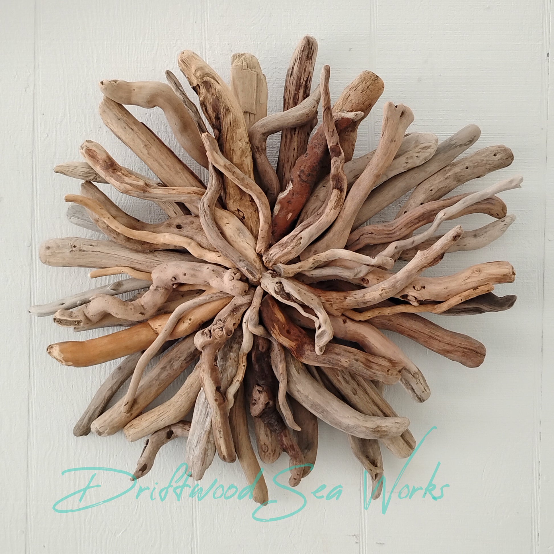 This one of a kind natural driftwood art wall sculpture measures 23 x 23 inches, has a hanger on the back.Every item is hand made by hand with sustainably gathered, Eco-friendly driftwood in Oregon.