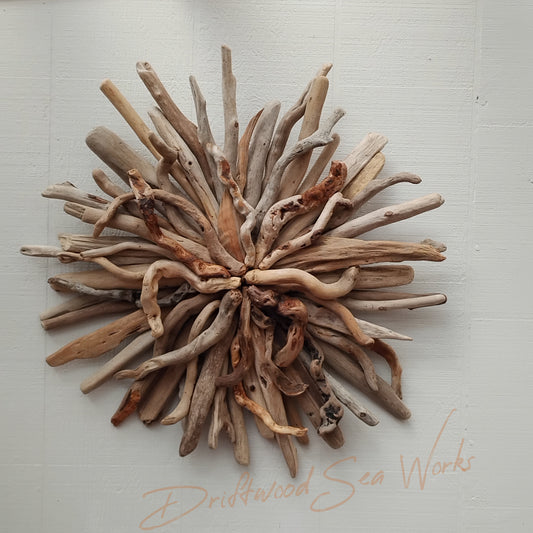 This unique and natural starburst measures twenty five by twenty five inches. I made it with driftwood I collected along the beaches of Oregon.
Each Driftwood sculpture is unique and hand made with hand selected driftwood pieces attached one piece at a time using nails for long lasting strength and durability not glue. I have also attached a saw tooth hook on the back for easy hanging as well.
