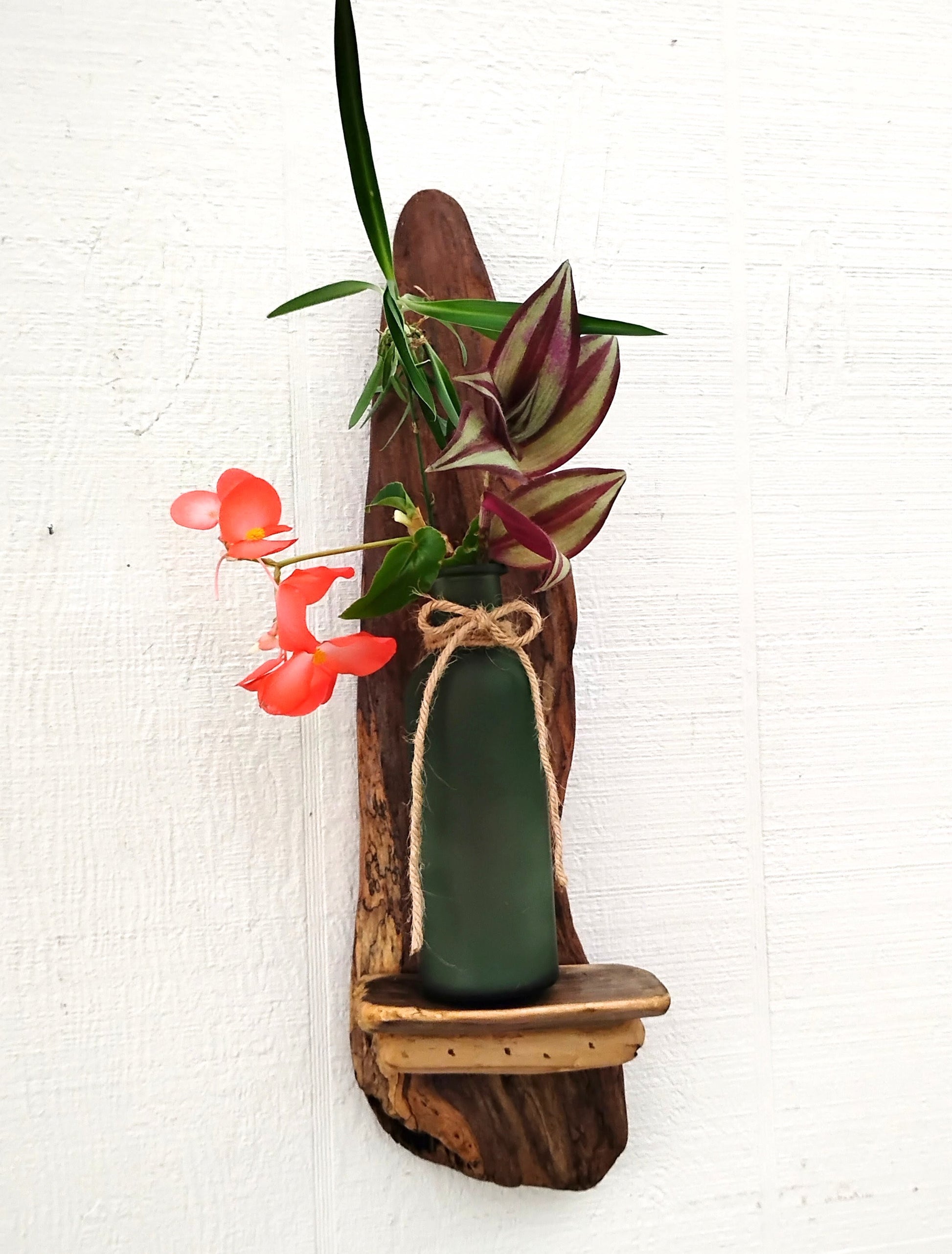 Rustic Driftwood Art flower vase with frosted green bottle that hangs on the wall