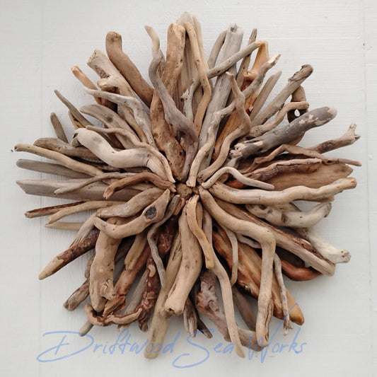 This unique and natural starburst round wall sculpture measures 27 x 27 inches. I made it with driftwood I collected along the beaches of Oregon.
Each Driftwood sculpture is unique and hand made with hand selected driftwood pieces attached one piece at a time using nails for long lasting strength and durability not glue. I have also attached a saw tooth hook on the back for easy hanging as well.
