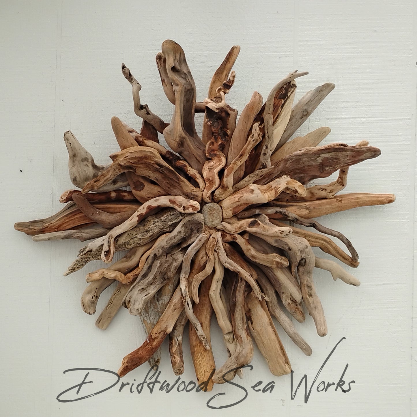 This made in Oregon, handcrafted driftwood wall hanging starburst measures 26 x 24 inches.