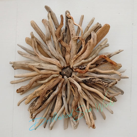 This unique and natural starburst measures 26 x 26 x 5 inches. I made it with driftwood I collected along the beaches of Oregon.
Each Driftwood sculpture is unique and hand made with hand selected driftwood pieces attached one piece at a time using nails for long lasting strength and durability not glue. I have also attached a saw tooth hook on the back for easy hanging as well