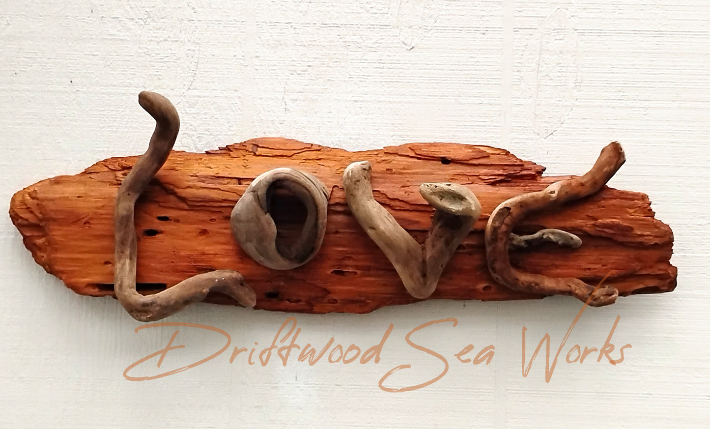 Add a touch of love and rustic charm to your home decor with our Love Sign Driftwood Art Wall Hanging. Made from natural driftwood,  this sign features the word "love" in a beautifully crafted design. Bring warmth and positivity to your space with this one-of-a-kind wall hanging.