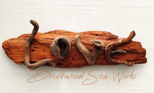 Add a touch of love and rustic charm to your home decor with our Love Sign Driftwood Art Wall Hanging. Made from natural driftwood,  this sign features the word "love" in a beautifully crafted design. Bring warmth and positivity to your space with this one-of-a-kind wall hanging.