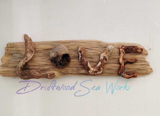 This natural driftwood LOVE sign measures 26 x 6 inches and was made by me with driftwood I collected on the beautiful Oregon Coastline. I used one natural, untreated piece of driftwood for the back. Next I selected the letters to form the word, LOVE. The entire piece is put together with nails, not glue for long lasting strength and durability. This sign is completely natural. There is no finish of any kind on it.  