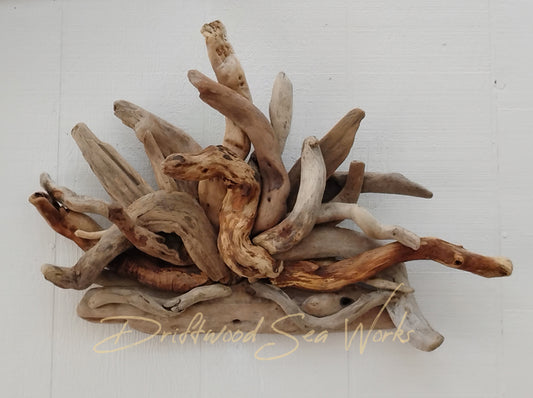 Hang this real driftwood wall sculpture above any entry way to bring a little beach to your home. Maybe it would look great in front of the fireplace when not being used. String some lights through it or wrap plants between the driftwood. However you choose to use this natural driftwood sculpture, it is sure to spark a conversation. This piece measures 25 x 18 inches. I made it with driftwood I collected at the ocean. Each sculpture is unique using hand selected driftwood pieces attached one at a time.