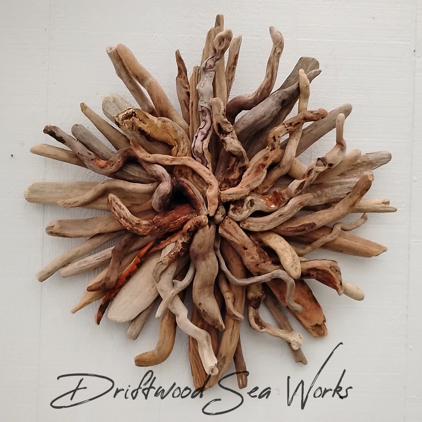 This starburst was hand-crafted using real naturally weathered driftwood. The starburst design adds a touch of texture, dimension and asymmetry to your interior style. Bring the beauty of the beach indoors with this stunning wall hanging. Create a stunning dynamic focal point with visual interest.