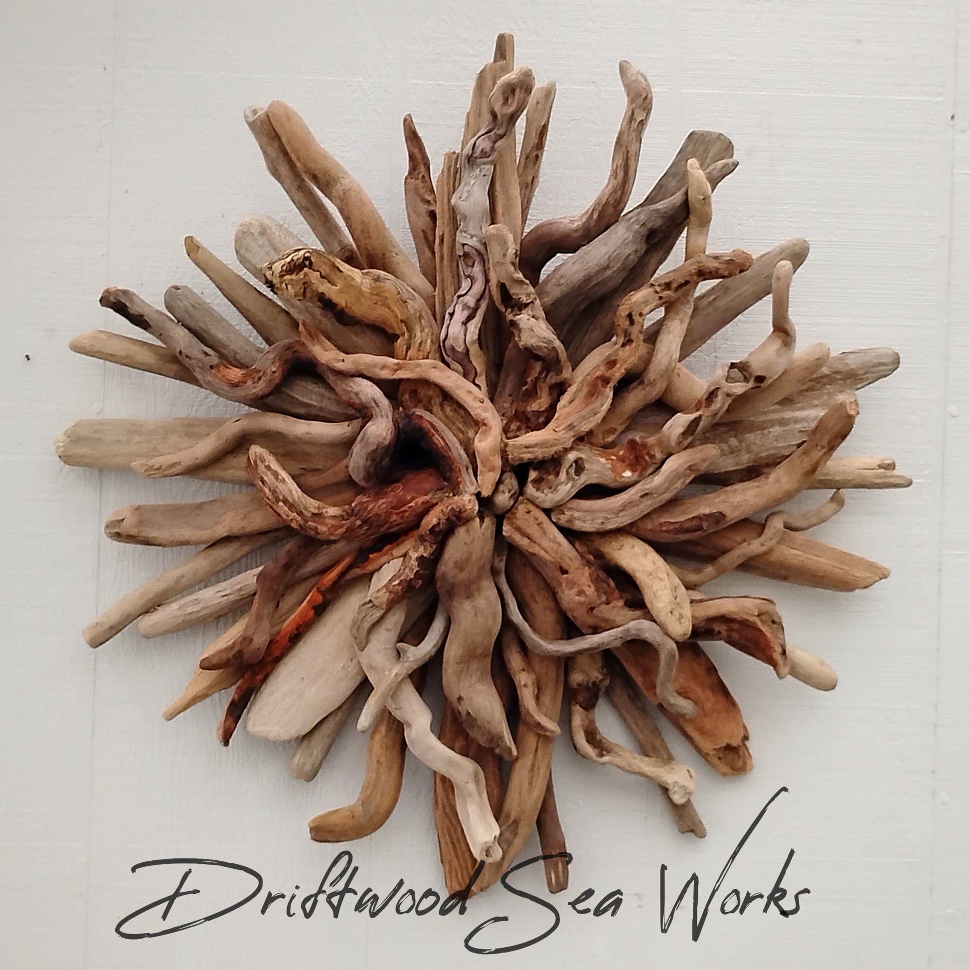 This starburst was hand-crafted using real naturally weathered driftwood. The starburst design adds a touch of texture, dimension and asymmetry to your interior style. Bring the beauty of the beach indoors with this stunning wall hanging. Create a stunning dynamic focal point with visual interest.